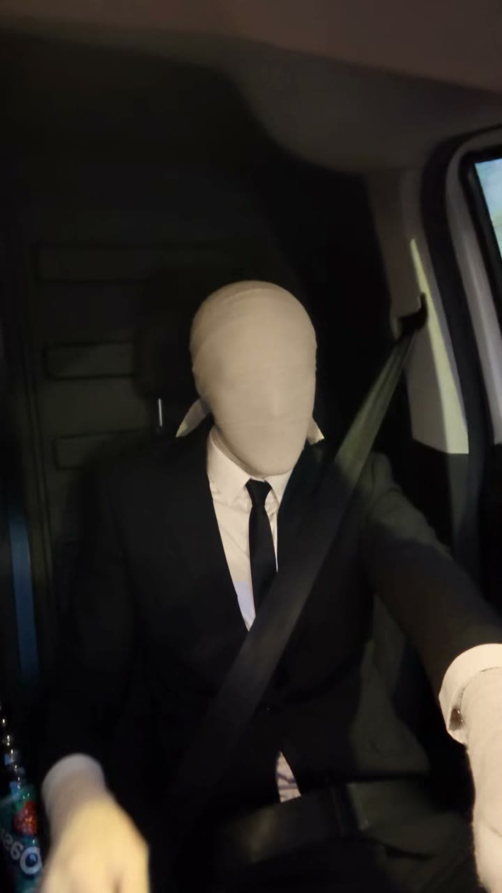 AI version: Mr. Nobody in the driver's seat of a van, head wrapped in gauze, black suit and tie